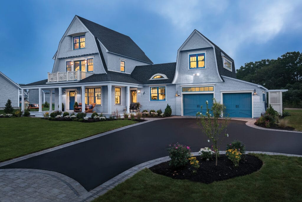 A freshly paved residential asphalt driveway